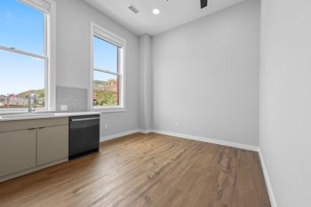 A room with a window overlooking a construction site.